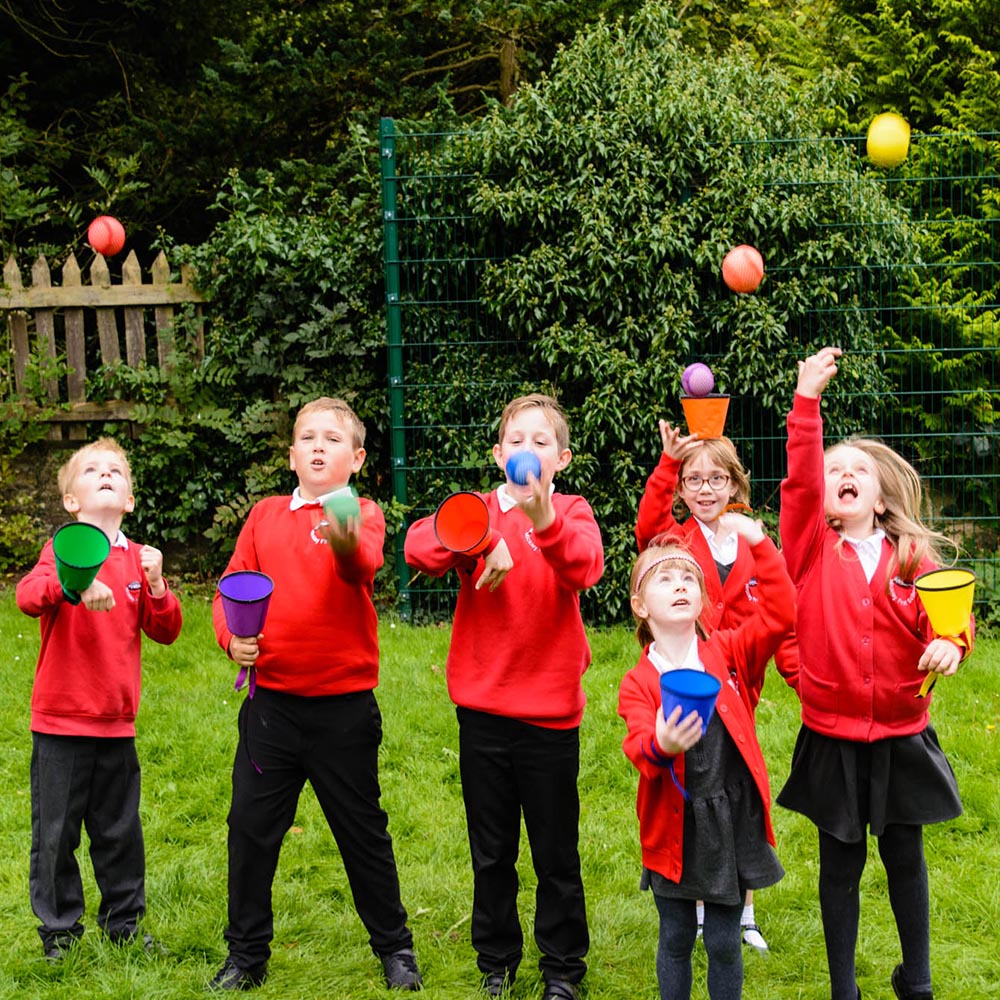 Set of 6 "ball catchers" with 6 colored soft balls. Supports the development of hand-eye coordination, teamwork, and individual skills. Suitable for individuals with special educational needs.