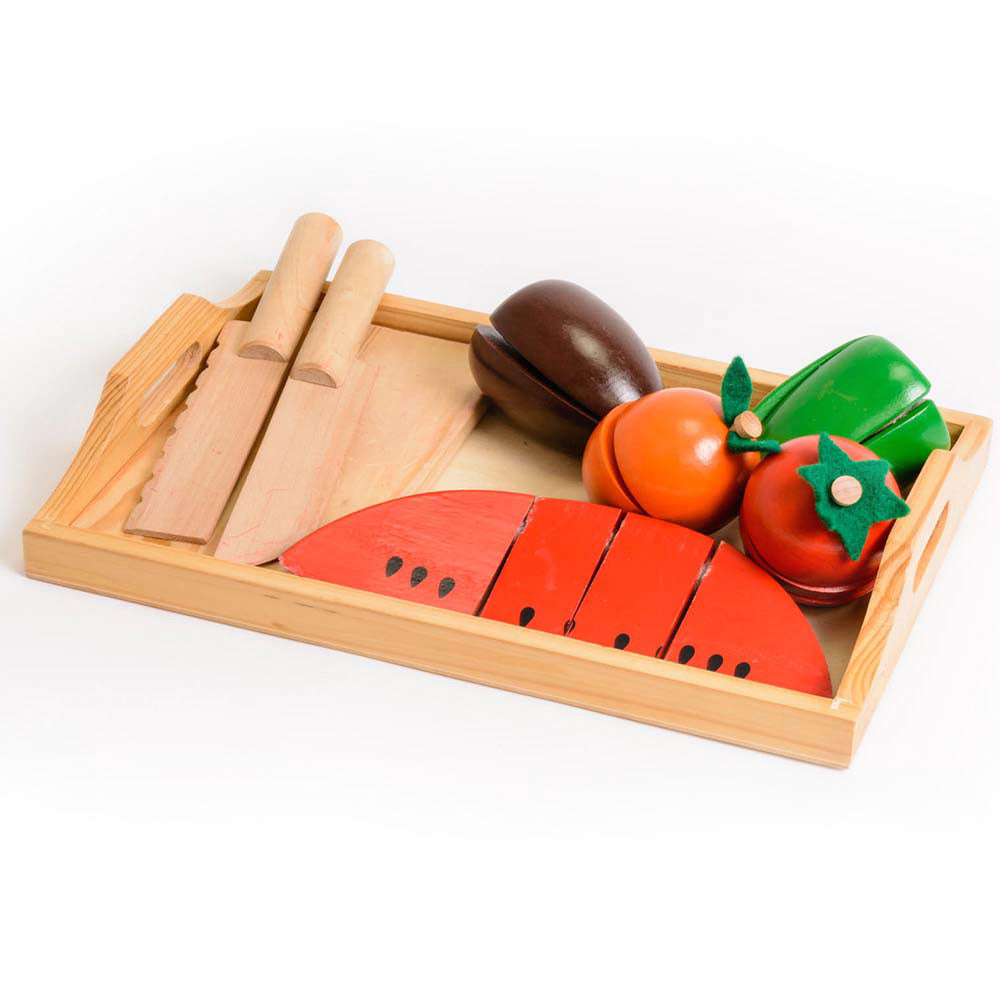 Wooden fruit and vegetable tray with VELCRO® pads, allowing children to safely cut through and reassemble the pieces using the included wooden knife. Promotes coordination skills, understanding of proportion, division, and illustrates simple fractions thr