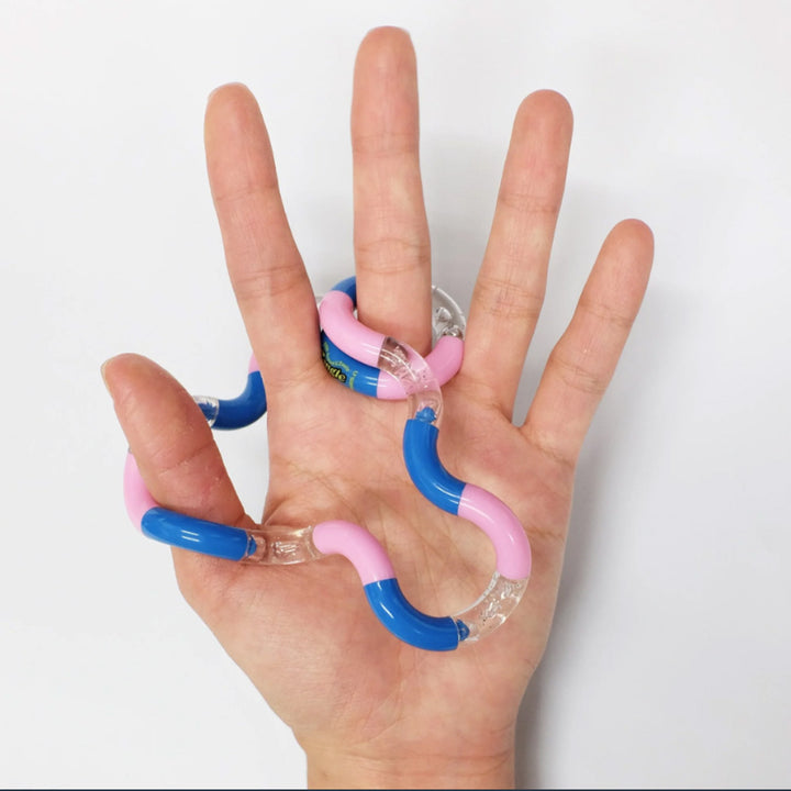 Tangles - a tactile toy consisting of interconnected curved sections, designed to provide both visual and tactile stimulation. Widely used as a fidget toy, it offers a satisfying sensory experience, promoting relaxation and focus. Its flexible structure a