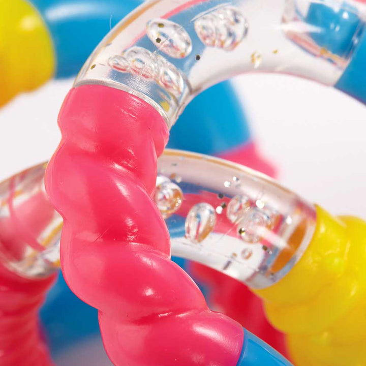 Tangles - a tactile toy consisting of interconnected curved sections, designed to provide both visual and tactile stimulation. Widely used as a fidget toy, it offers a satisfying sensory experience, promoting relaxation and focus. Its flexible structure a