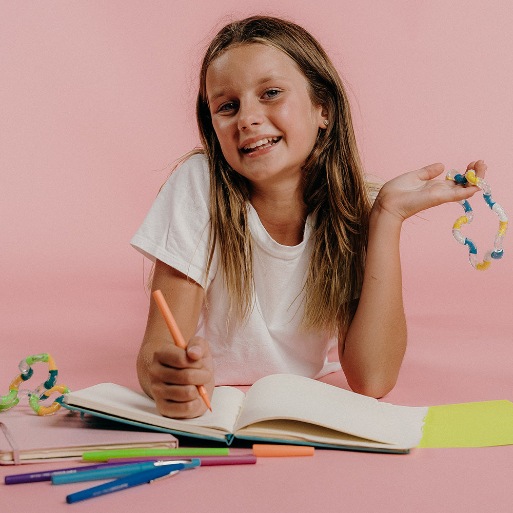 Tangles - a tactile toy consisting of interconnected curved sections, designed to provide both visual and tactile stimulation. Widely used as a fidget toy, it offers a satisfying sensory experience, promoting relaxation and focus. Its flexible structure a