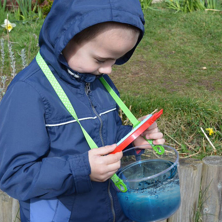 Giant Magnifying Pot offers an up-close view of tiny creatures with its 2.5x magnifying lid featuring air holes. Use it to collect and examine insects, leaves, fossils, and more. It also functions as a mini aquarium for tadpoles and small fish. Complete with an adjustable, detachable strap and 2 tweezers for convenient handling